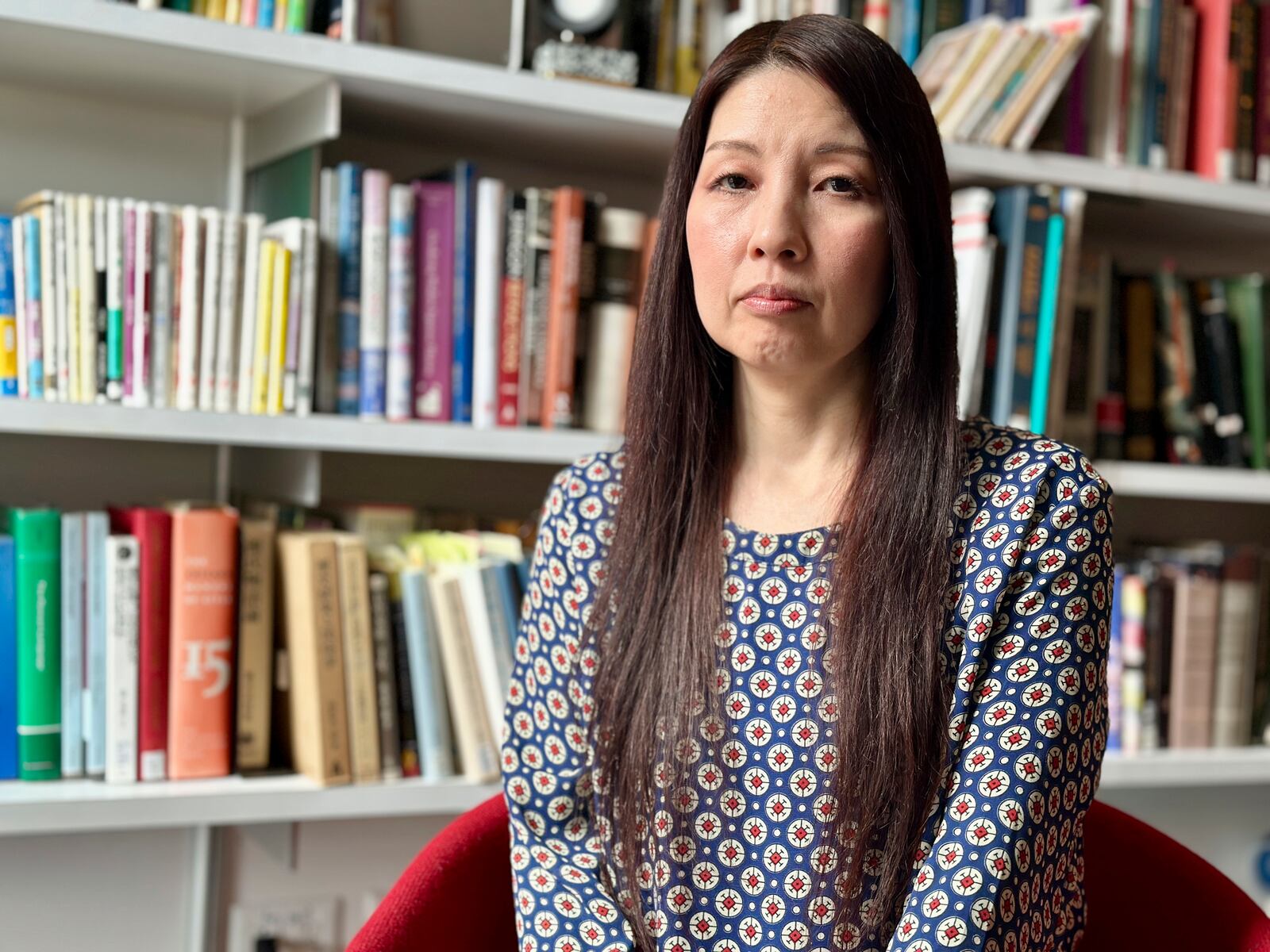Sachi Schmidt-Hori, a Japanese literature and culture professor who was a consultant on the Assassin's Creed Shadows video game, poses for a portrait in her office at Dartmouth College in Hanover, New Hampshire, on April 2, 2025. (AP Photo/Holly Ramer)