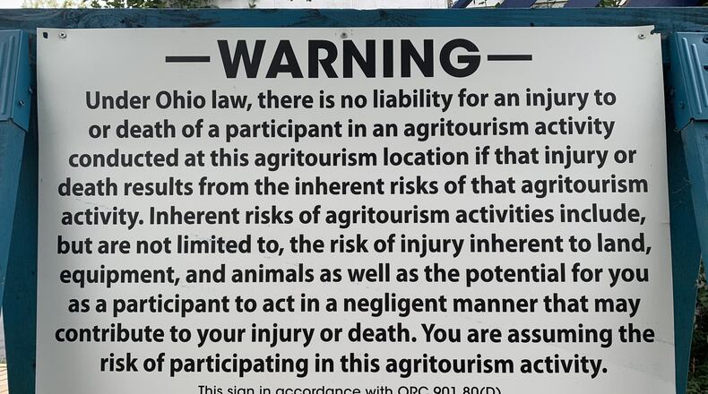 This Ohio Farm Bureau sign includes language about the liability risk assumed by those who visit agritourism farms. Stoney Hill Bed and Breakfast has a similar sign on its property at 7757 Upper Miamisburg Road in Miami Twp. CONTRIBUTED.