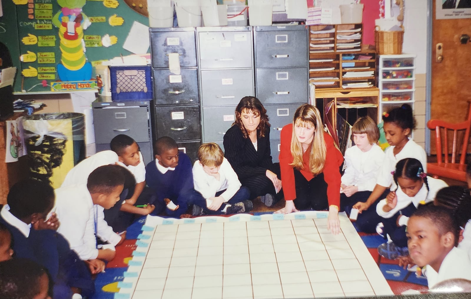 Katie Grothaus (back middle) with a fellow student teacher in 1999, while she was a student at Wright State University. She was doing student teaching work at EJ Brown Elementary School in Dayton. CONTRIBUTED