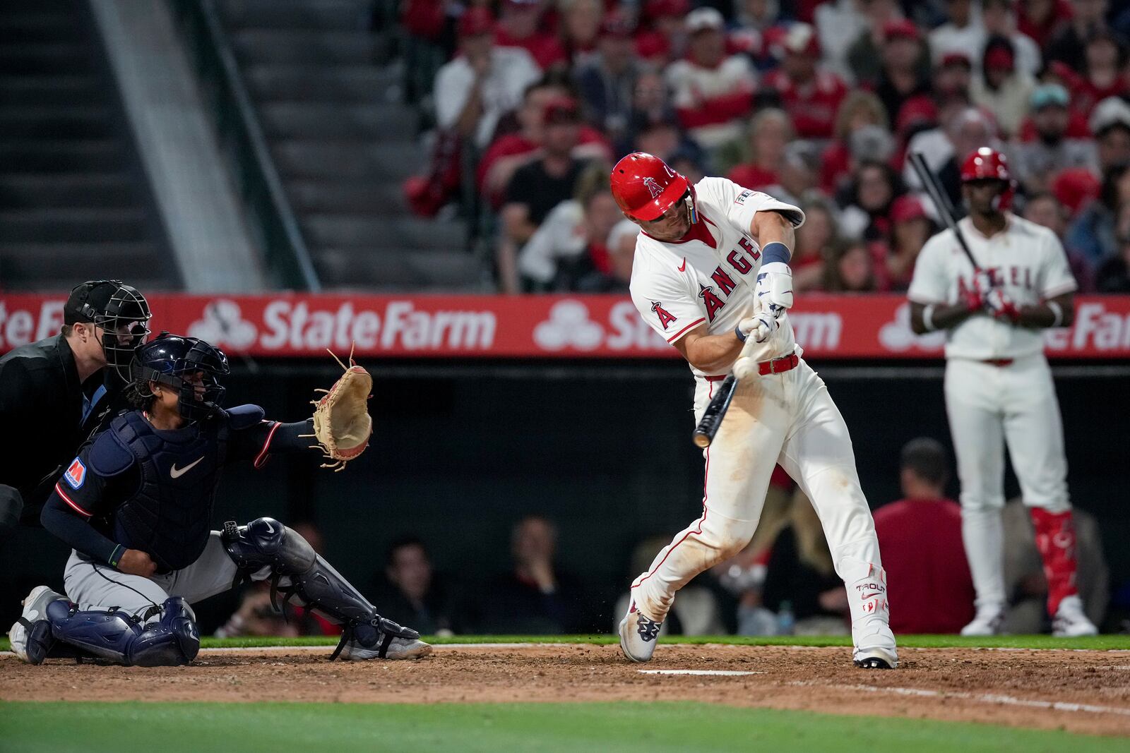 Los Angeles Angels' Mike Trout makes contact with the ball during the sixth inning of a baseball game against the Cleveland Guardians in Anaheim, Calif., Friday, April 4, 2025. (AP Photo/Eric Thayer)