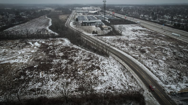 The city of Huber Heights purchased land on the north and south side of Executive Boulevard, which is in the center of the photo. In the background is the Rose Music Center and Warped Wing Brewery & Smokery. Interstate 75 is on the far right. JIM NOELKER/STAFF