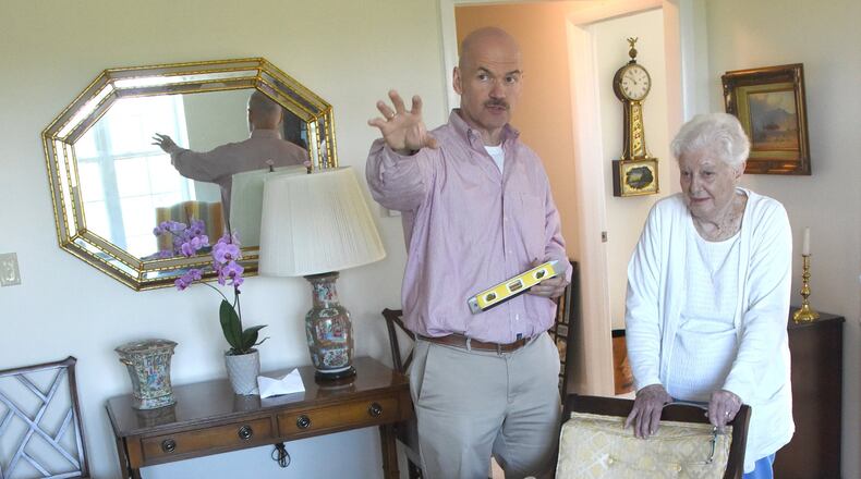Paul Regan talks with Betty Price, of Fox Chapel, as he helps her to move into Longwood at Oakmont Retirement Home, in Plum Boro, Pa. (Darrell Sapp/Pittsburgh Post-Gazette/TNS)