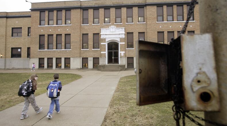 A plan in Waynesville to build a new elementary school and preserve part of an old school in a community center hinges on passage of a 4.68 mill, 37-year bond issue on Nov. 7 ballots. It is too close to call still, with provisional ballots still to be counted. STAFF/TY GREENLEES