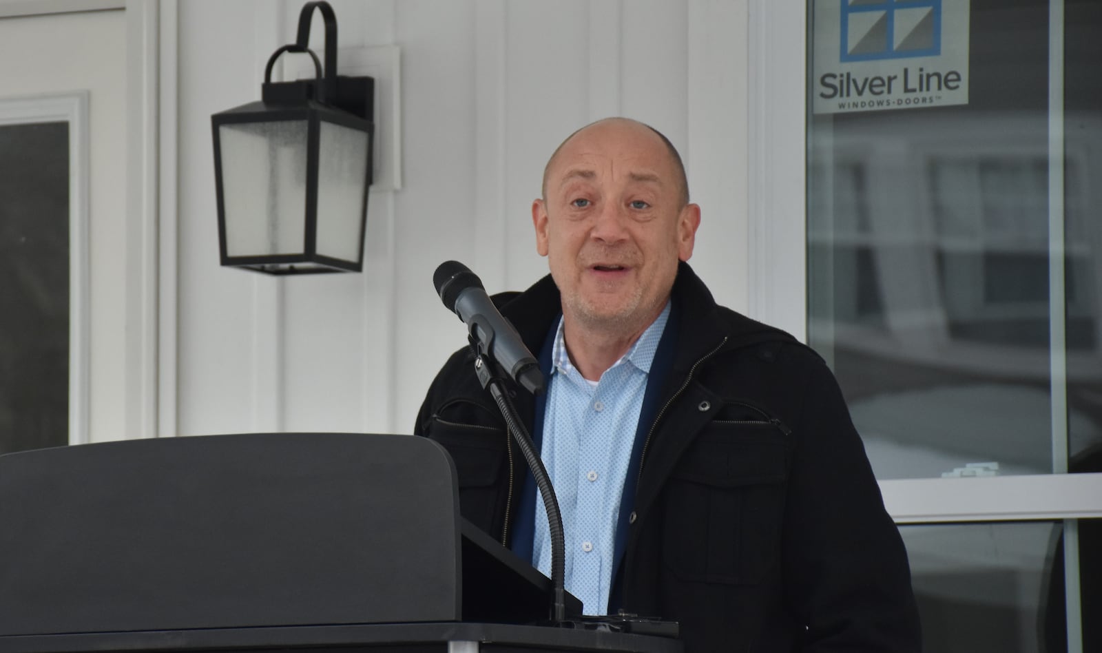 Timothy Mislansky, president and CEO of Wright-Patt Credit Union, talks about the new homes being built in Dayton's Fairview neighborhood at a community event on Dec. 16, 2025. WPCU's Sunshine Community Fund is providing funding support to help build 30 new homes in northwest Dayton. CORNELIUS FROLIK / STAFF