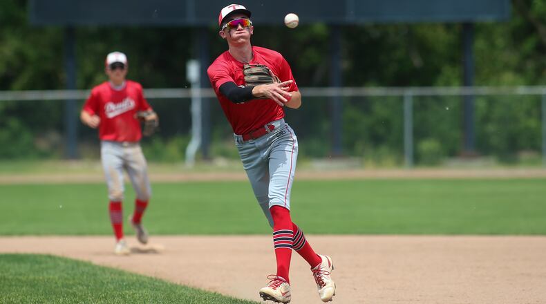 Tippecanoe High School sophomore second baseman Max Dunaway throws the ball to first base during their game against Kenton Ridge on Tuesday, May 25 at Carleton Davidson Stadium in Springfield. The Red Devils won 2-0. Michael Cooper/CONTRIBUTED