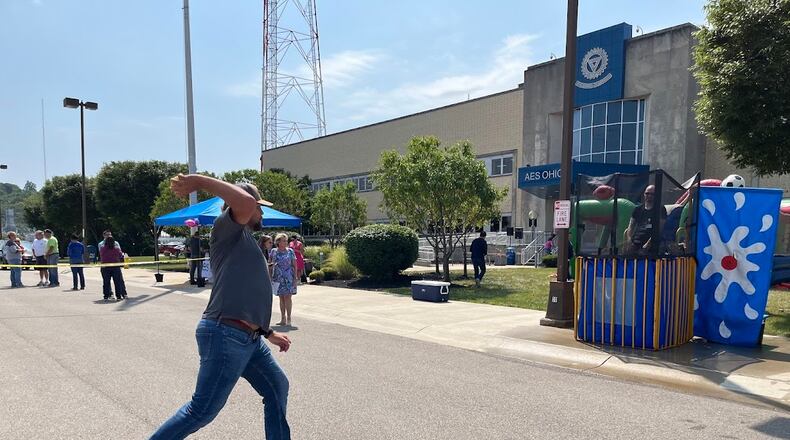 Dayton electric utility AES Ohio and the United Way celebrated an enduring partnership Wednesday. Among the fun activities: a dunking booth on the parking lot of AES Ohio's Dryden Road operations center. THOMAS GNAU/STAFF
