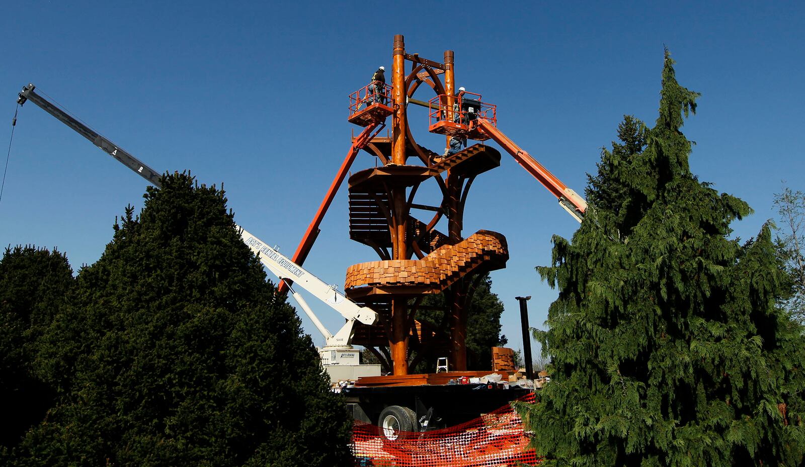 Workers from Solica Construction of Blue Ash, Ky. work in April 2012 on the Tree Tower, an observation tower at Cox Arboretum MetroPark. The tower, with an observation deck about 50 feet off the ground, opened later that year. STAFF PHOTO BY CHRIS STEWART