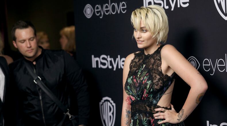 FILE - In this Jan. 8, 2017, file photo, Paris Jackson arrives at the InStyle and Warner Bros. Golden Globes afterparty at the Beverly Hilton Hotel in Beverly Hills, Calif. Jackson said in a Rolling Stone interview published online on Jan. 24, 2017, that she tried to kill herself “multiple times” in the years after her father’s death. (Photo by Matt Sayles/Invision/AP, File)