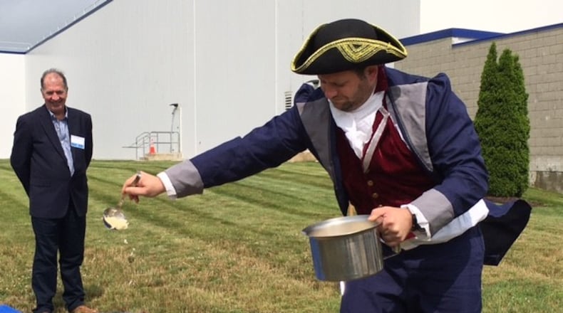 A White Castle "town crier" "christens" ground about to be broken for construction with grilled onions. The White Castle food plant in Vandalia will double in size. THOMAS GNAU/STAFF