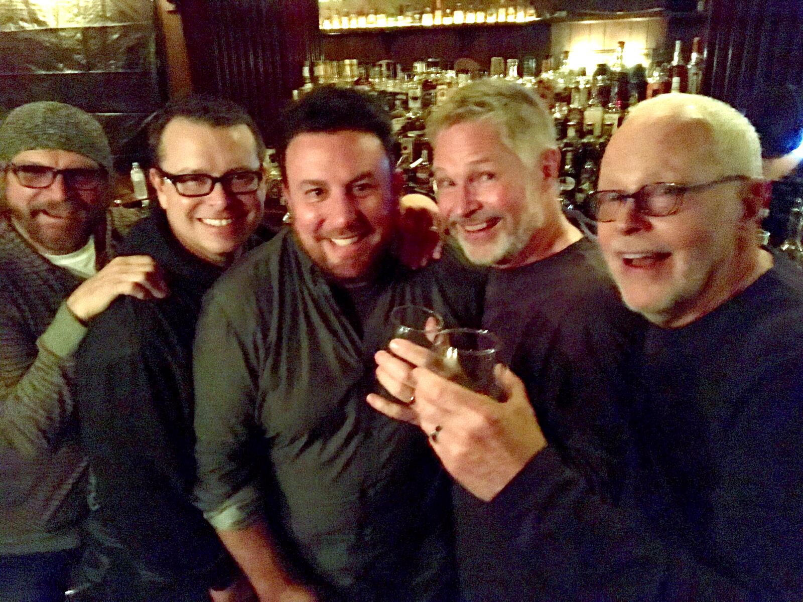Mike Colvin (center) with friends at the Century Bar. CONTRIBUTED PHOTO