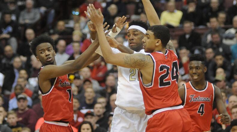 Trotwood’s Amari Davis (left), Torrey Patton and Myles Belyeu. Akron St. Vincent-St. Mary defeated Trotwood-Madison 62-60 in a boys high school basketball D-II state semifinal at OSU’s Schottenstein Center in Columbus on Thursday, March 23, 2017. MARC PENDLETON / STAFF