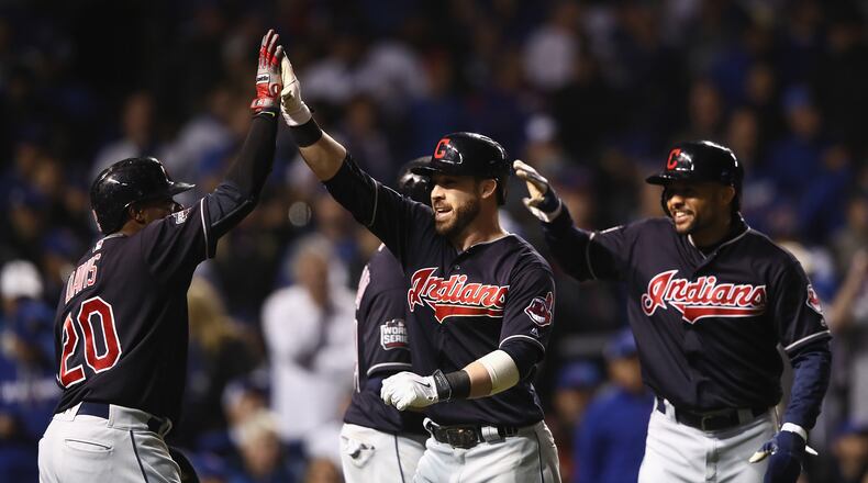 CHICAGO, IL - OCTOBER 29: Rajai Davis #20 and Coco Crisp #4 of the Cleveland Indians congratulate Jason Kipnis #22 after Kipnis hit a home run in the seventh inning against the Chicago Cubs in Game Four of the 2016 World Series at Wrigley Field on October 29, 2016 in Chicago, Illinois. (Photo by Ezra Shaw/Getty Images)