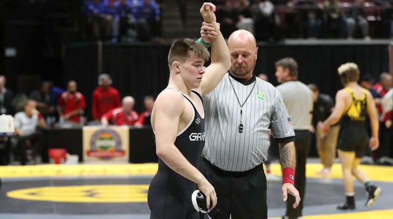 Graham High School senior Brogan Tucker raises his arm in the air after winning a match on Friday, March 7 at the Schottenstein Center in Columbus. Tucker won his fourth straight state championship, winning D-III title at 134 pounds. Dave Thompson/CONTRIBUTED