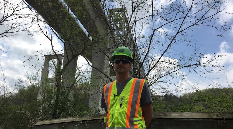 Project Engineer Adam Treiber is shown beneath a section of the Jeremiah Morrow Bridge over Interstate 71 in Warren County south of Little Miami River. STAFF/LAWRENCE BUDD