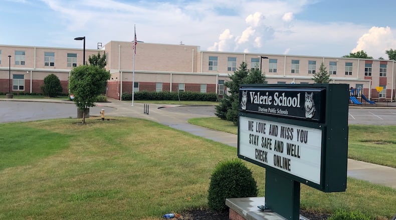 The sign outside Dayton's Valerie Elementary in July 2020 tells students that school staff love them and miss them.