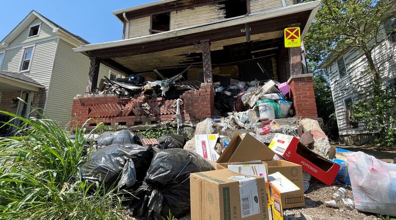 A house in West Dayton that is delinquent on its taxes. CORNELIUS FROLIK / STAFF