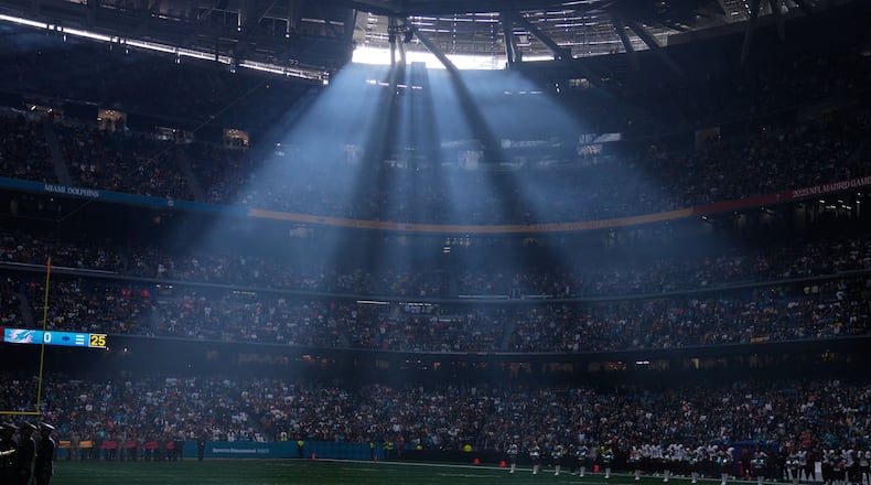 FILE - A shaft of sunlight streams into the stadium before an NFL football game between the Washington Commanders and the Miami Dolphins in Madrid, Spain, Sunday, Nov. 16, 2025. (AP Photo/Manu Fernandez, file)
