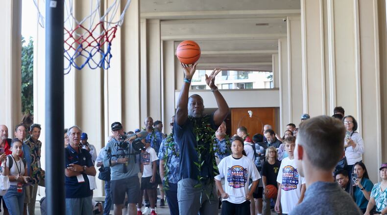 Dayton's Anthony Grant participates in a free-throw shooting contest at a Maui Invitational press conference on Sunday, Nov. 24, 2024, at the Hyatt Regency Maui Resort. David Jablonski/Staff