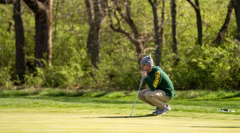 Wright State's Bryce Haney surveys a putt during the Wright State Invitational last month at Heatherwoode Golf Club in Springboro. Wright State Athletics photo