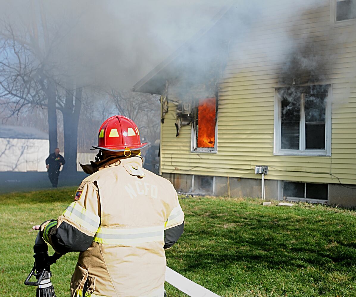 PHOTOS: Crews fight fire in on National Road in New Carlisle