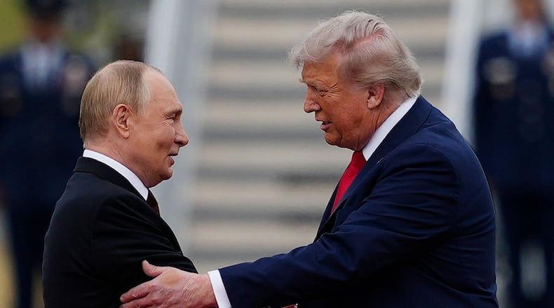 FILE - U.S. President Donald Trump greets Russian President Vladimir Putin, Aug. 15, 2025, at Joint Base Elmendorf-Richardson, Alaska. (AP Photo/Julia Demaree Nikhinson, File)