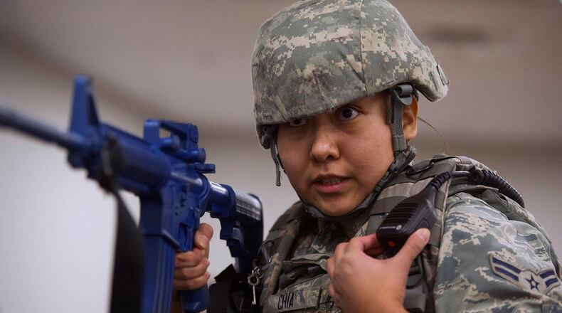 Airman 1st Class Valeri Chia, 88th Security Forces Squadron patrolman, reports her status Jan. 30, 2017, during an active-shooter exercise on Wright-Patterson Air Force Base. The exercise was part of routine, periodic training to help provide a safe and secure environment on the base. (U.S. Air Force photo/R.J. Oriez)