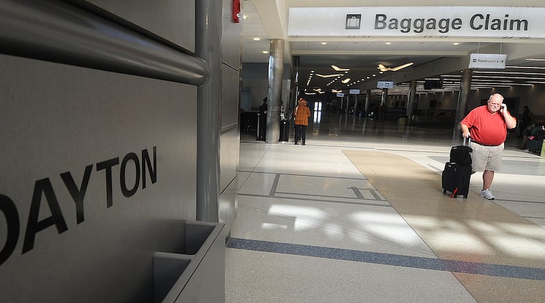 A traveler walks inside the the Dayton International Airport. The airport, using state funding, will spend $72 million to put in new apron and rehabilitate existing apron. STAFF