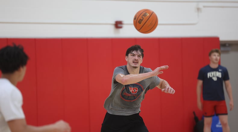 Dayton's isaac Jack makes a pass during a summer practice on Monday, July 22, 2024, at the Cronin Center. David Jablonski/Staff