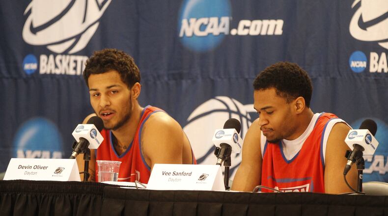 Dayton’s Devin Oliver, left, and Vee Sanford talk to the media after practice at FedExForum on Wednesday, March 26, 2014, in Memphis, Tenn. David Jablonski/Staff