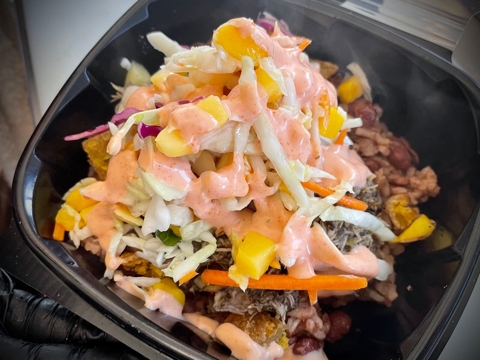 Home Cooked Vibes, a Fairborn food truck, is opening a brick-and-mortar location inside Building 45 in Area B at Wright-Patterson Air Force Base. Pictured is the Jerk Chicken Bowl. NATALIE JONES/STAFF