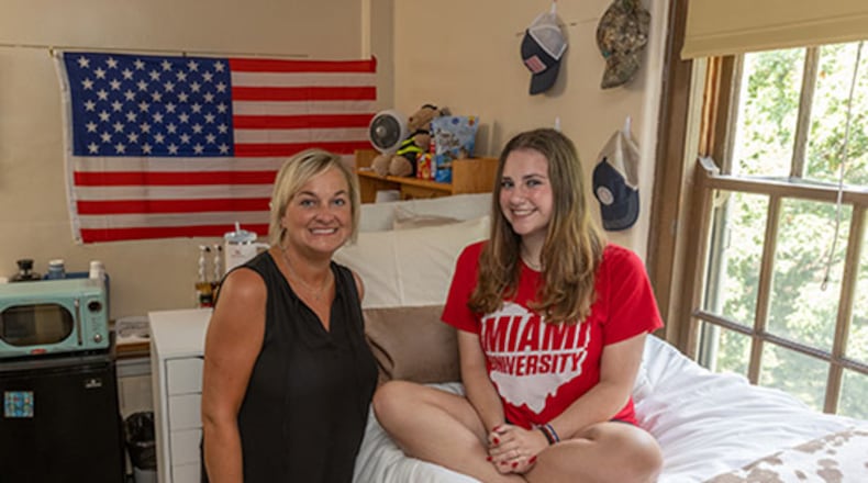 Laura Everett Bowling, left, and her daughter Sarah Bowling, shown on move-in day Thursday, Aug. 24, 2023, were assigned the same Emerson Hall room 33 years apart at Miami University. SCOTT KISSELL/CONTRIBUTED