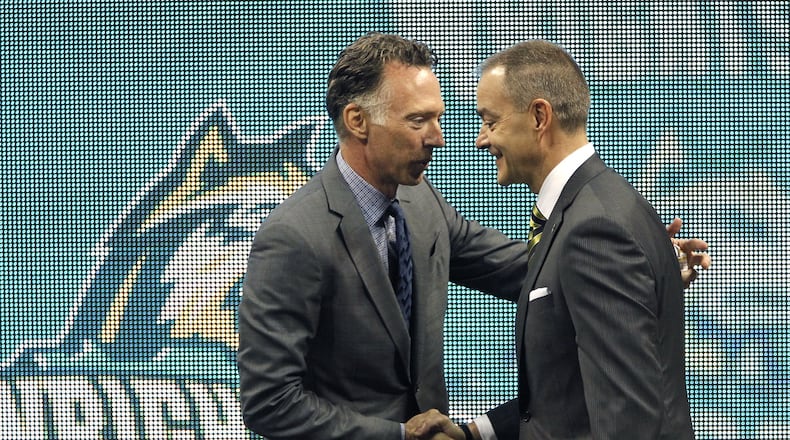 Wright State University Athletics Director Bob Grant (left) introduces Scott Nagy, the new WSU head men’s basketball coach during a press conference. Nagy, formerly of South Dakota State, is the ninth head coach in the history of the Raiders men’s basketball program. LISA POWELL / STAFF