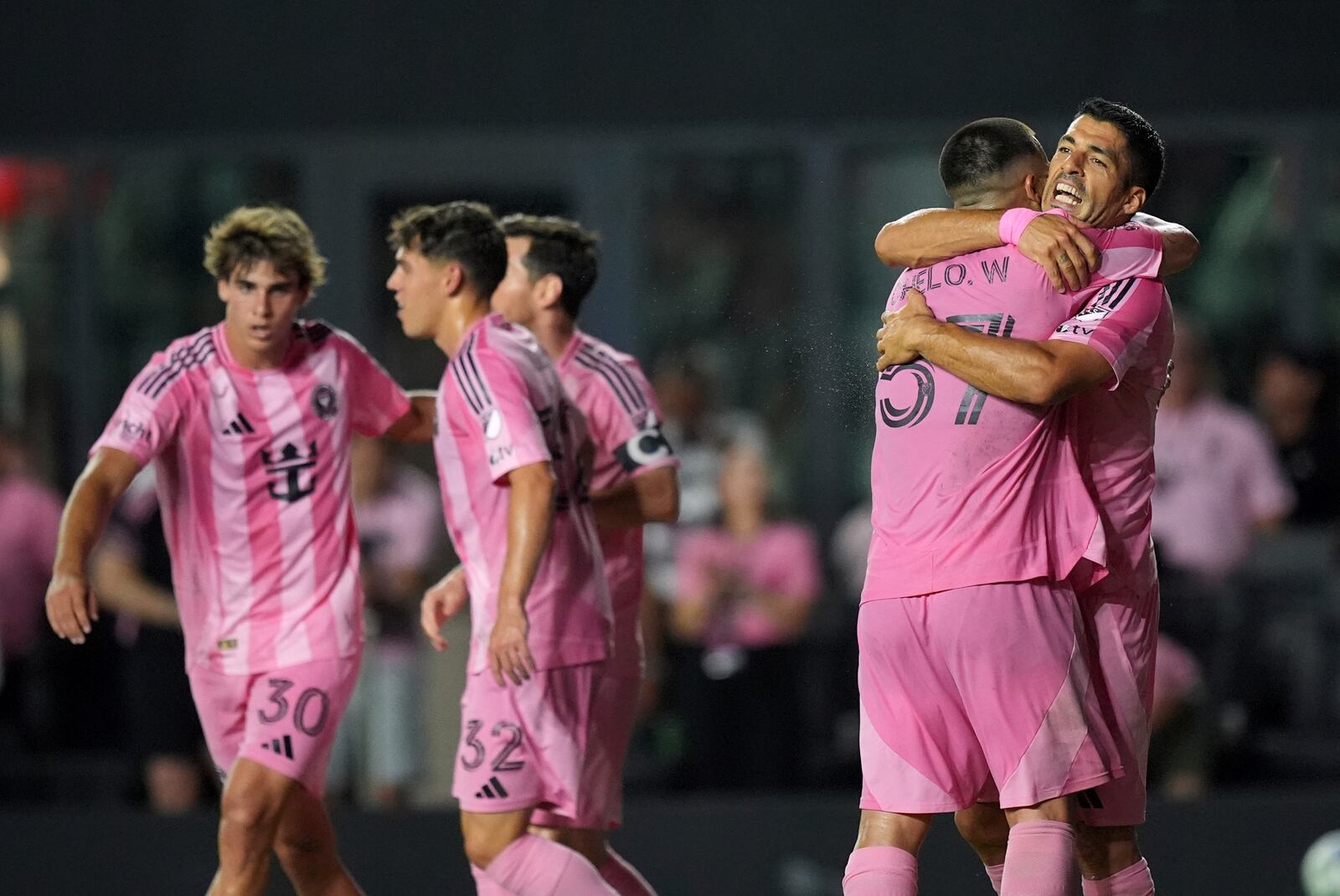 Inter Miami forward Luis Suarez, right, celebrates with teammates after scoring his side's fourth goal against Columbus Crew during the second half of an MLS soccer match, Saturday, May 31, 2025, in Fort Lauderdale, Fla. (AP Photo/Rebecca Blackwell)