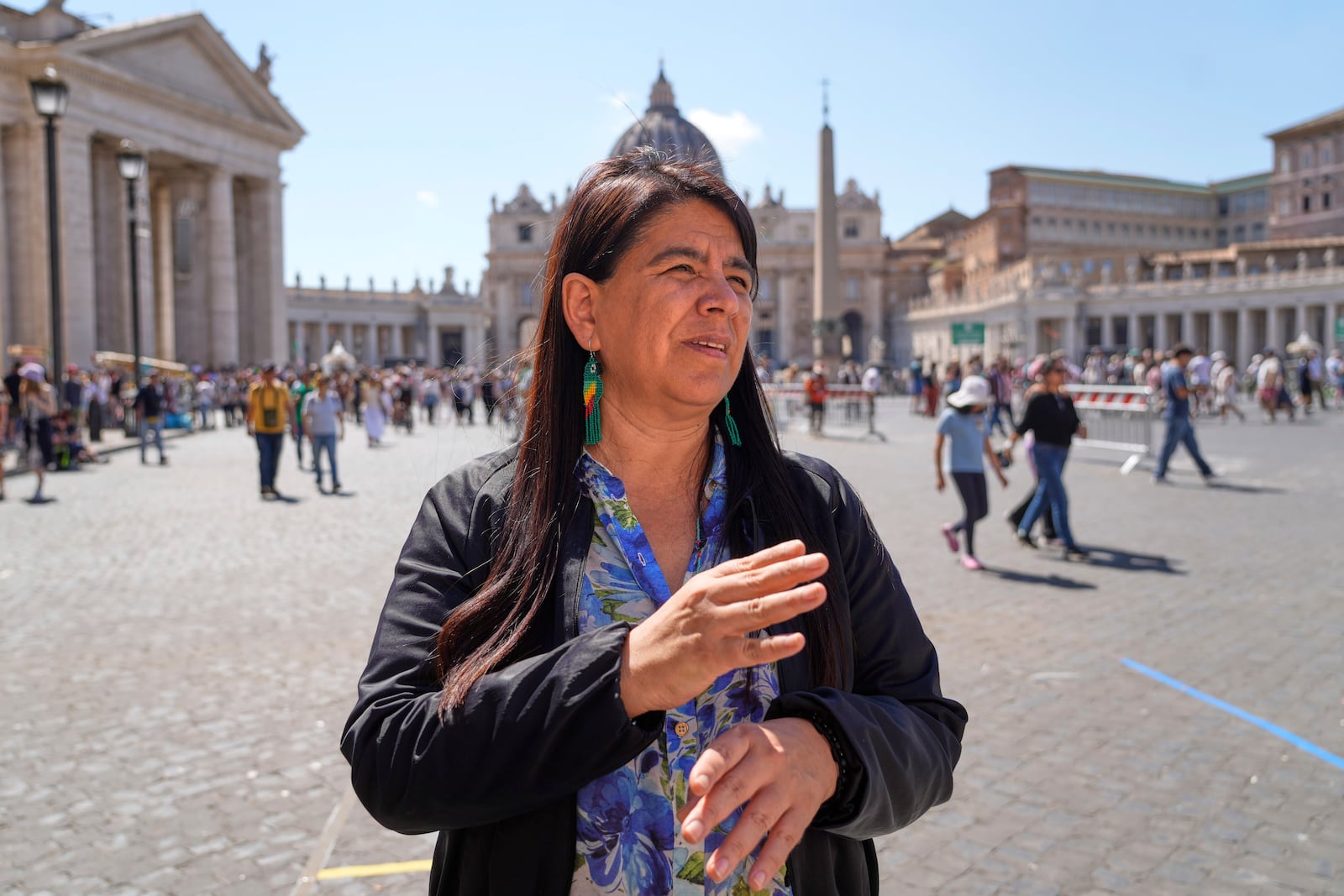 Peruvian investigative journalist Paola Margot Ugaz Cruz talks with the Associated Press near St. Peter's Square at the Vatican, Monday, May 19, 2025. (AP Photo/Gregorio Borgia)