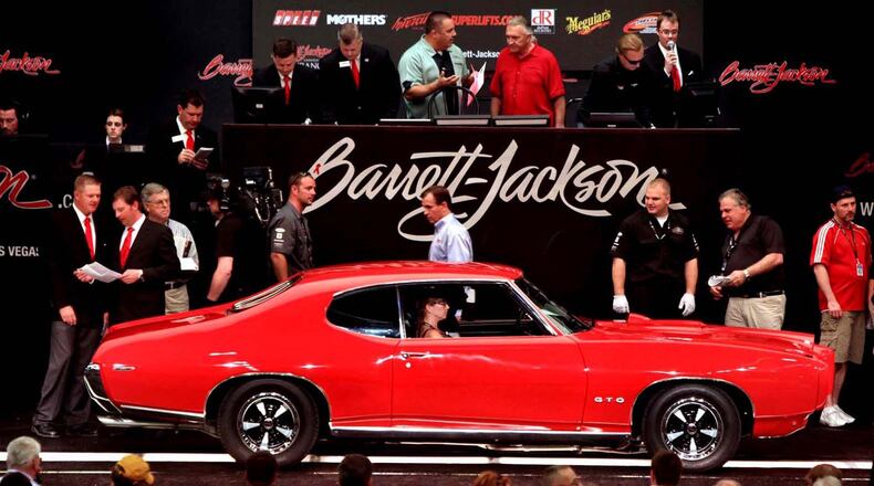 A 1969 Pontiac GTO 2-door hardtop rolls onto the auction block at Barrett Jackson Auction in Scottsdale. Barrett-Jackson photo