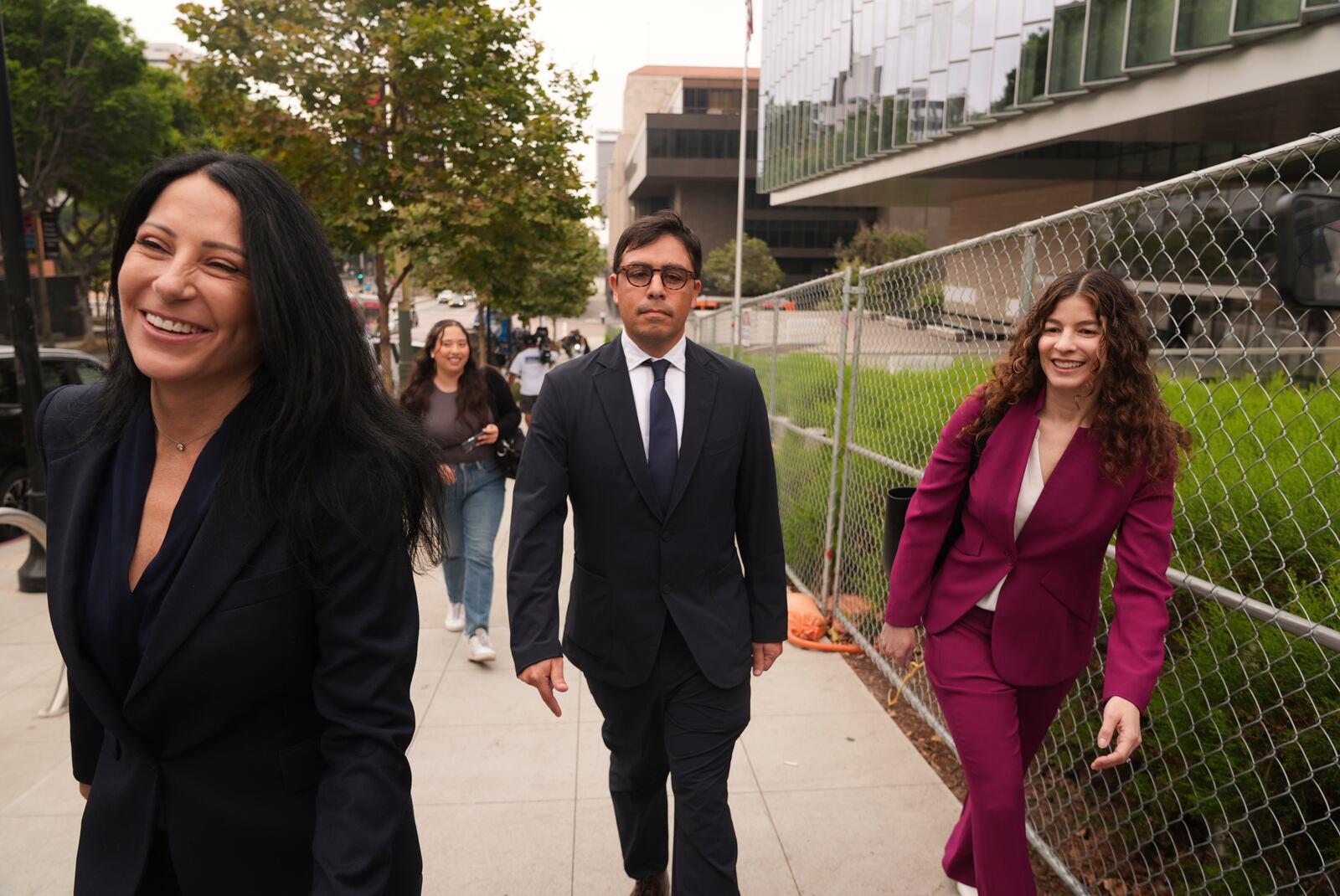 Dr. Salvador Plasencia, center, flanked by his attorneys Debra S. White and Karen L. Goldstein, leaves federal court on Wednesday, July 23, 2025 in Los Angeles, after pleading guilty to giving ketamine to Matthew Perry, leading up to the actor's 2023 overdose death. (AP Photo/Damian Dovarganes)