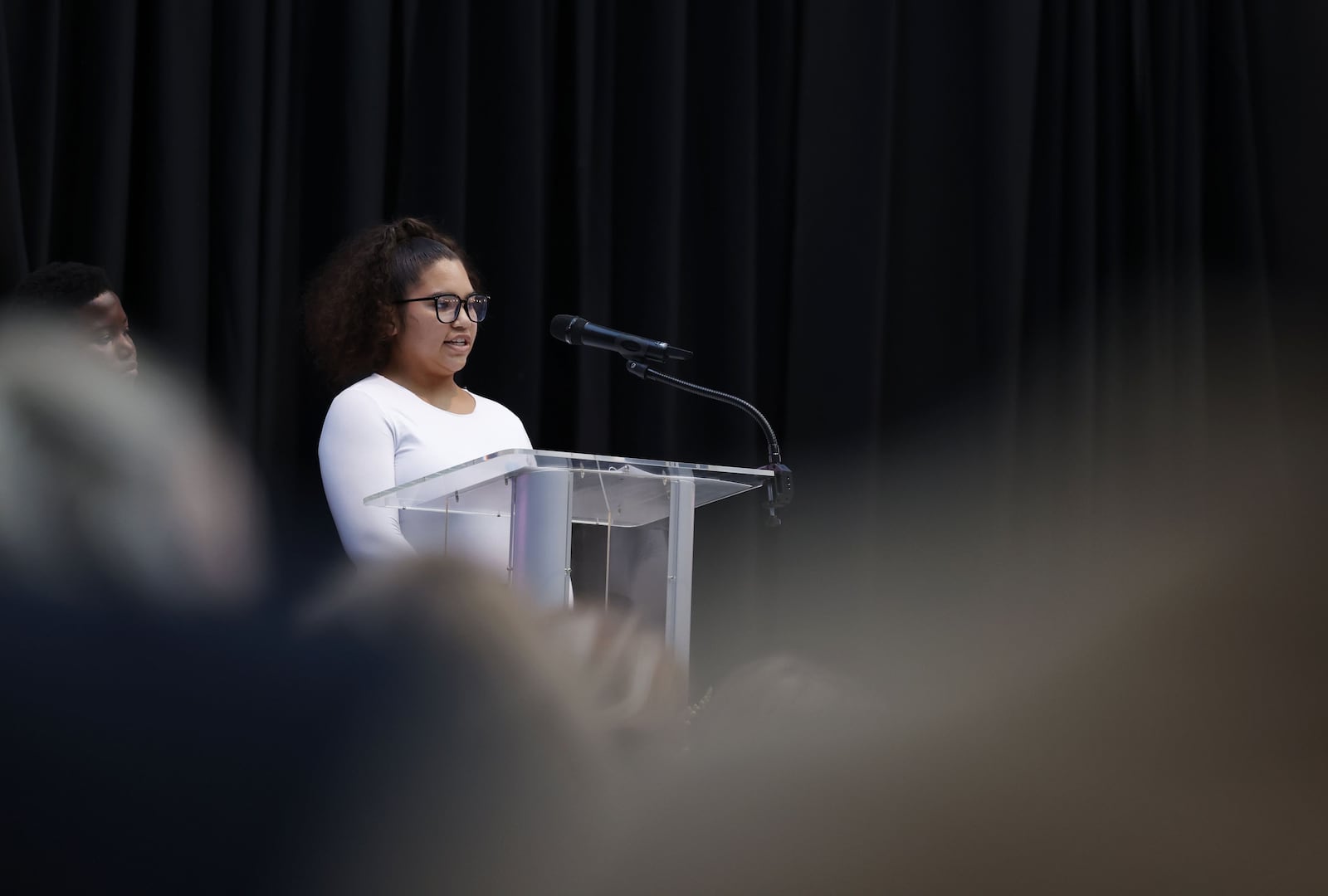 Youth of the Year, Ke'mya Lam, 18, speaks to the crowd during The Boys & Girls Club of Dayton's fifth annual Spark Great Futures fundraiser Thursday, Oct. 23, 2025 at Dayton Arcade. The signature event, sponsored by CareSource, celebrates the power of mentorship, leadership, and community while shining a spotlight on the transformational impact of the Boys & Girls Club of Dayton. WNBA Stars Kelsey Mitchell and Sophie Cunningham were special guests for the event. NICK GRAHAM/STAFF
