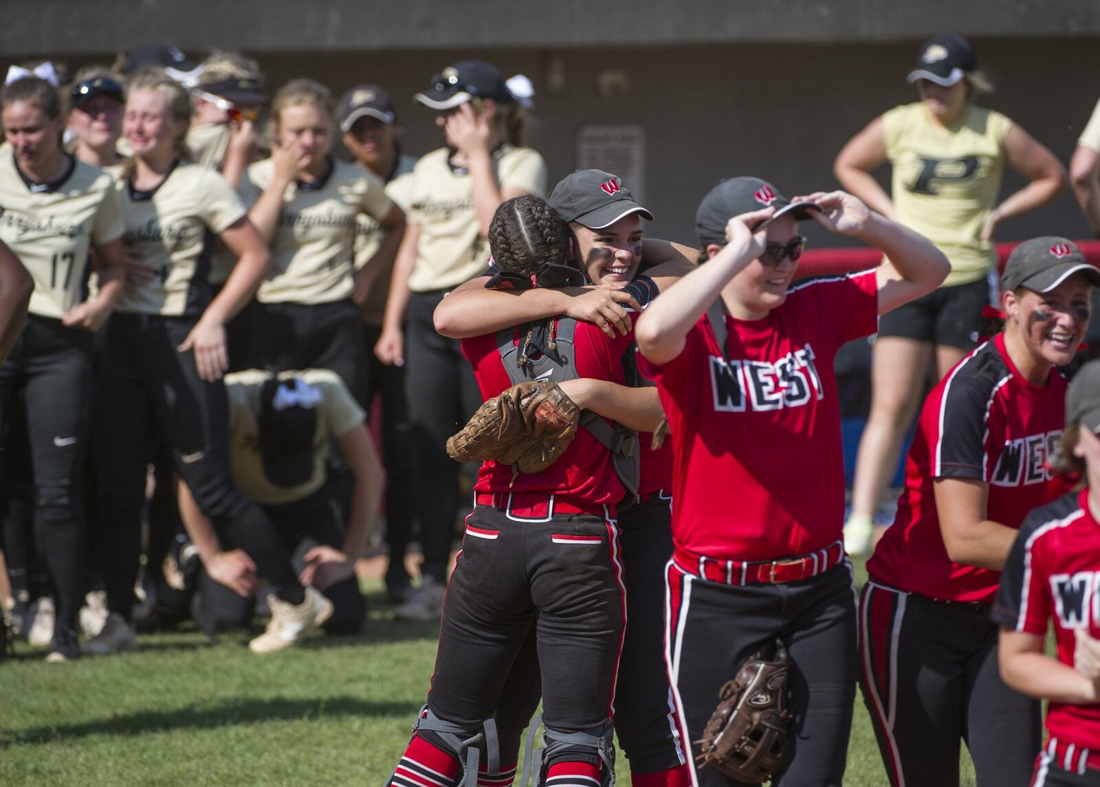Lakota West players celebrate as Perrysburg players show their dejection Thursday afternoon as the Firebirds won 2-1 in a Division I state semifinal at Firestone Stadium in Akron. PHIL LONG/OHIO PRESS PHOTO SYSTEM