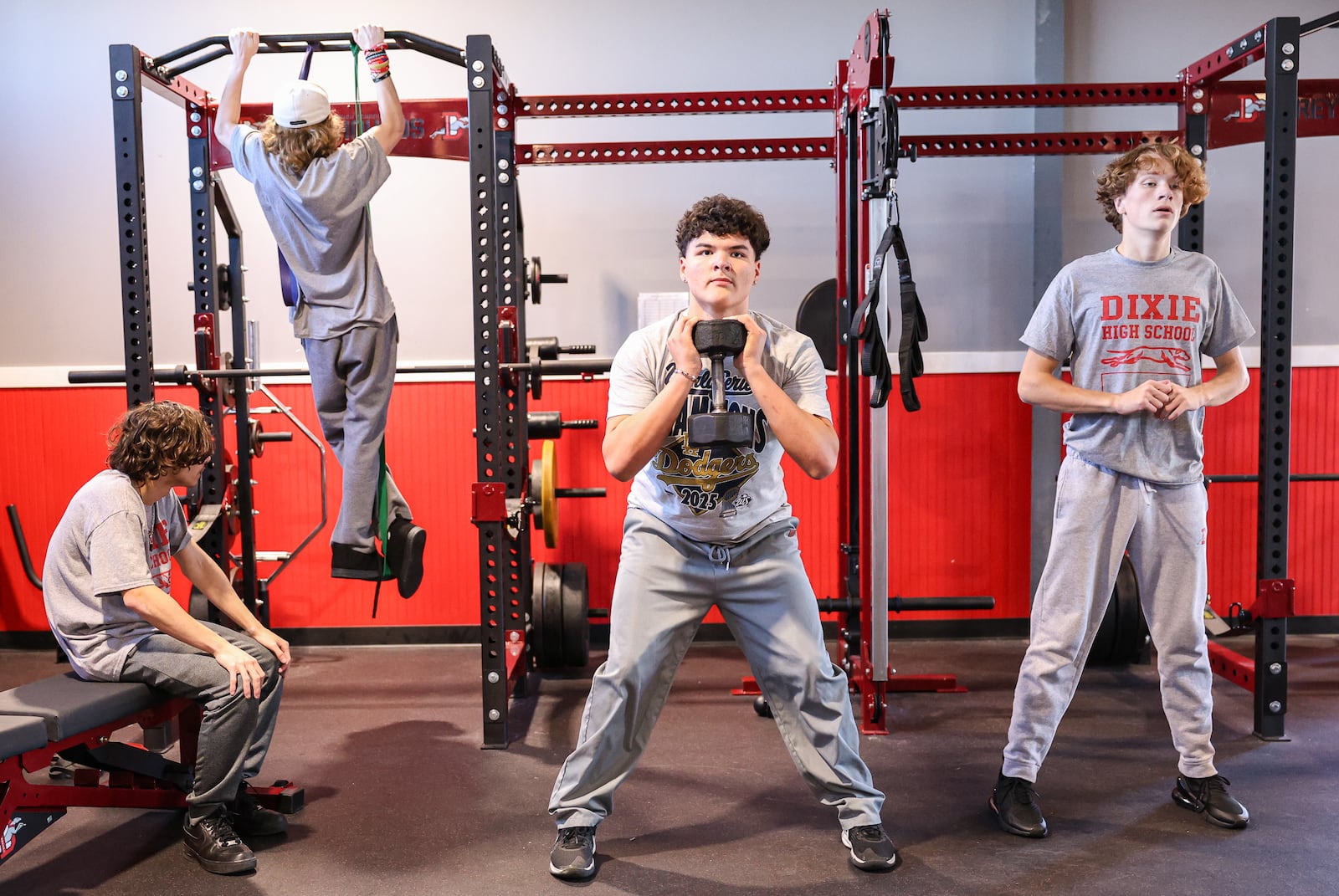 Dixie High School junior Julian Zaragoza (center) and classmates in a weight training class participate in a "Murph," workout on Wednesday, Nov. 5 in the school's weight room facility in New Lebanon. Students in Jonathon Hutchison's fifth period class researched soldiers who inspired the workouts as part of the project. BRYANT BILLING/STAFF