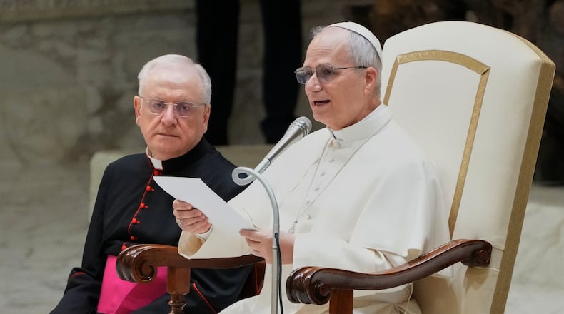 Pope Leo XIV reads his message during a weekly general audience at the Vatican, Wednesday, Feb. 11, 2026. (AP Photo/Gregorio Borgia)