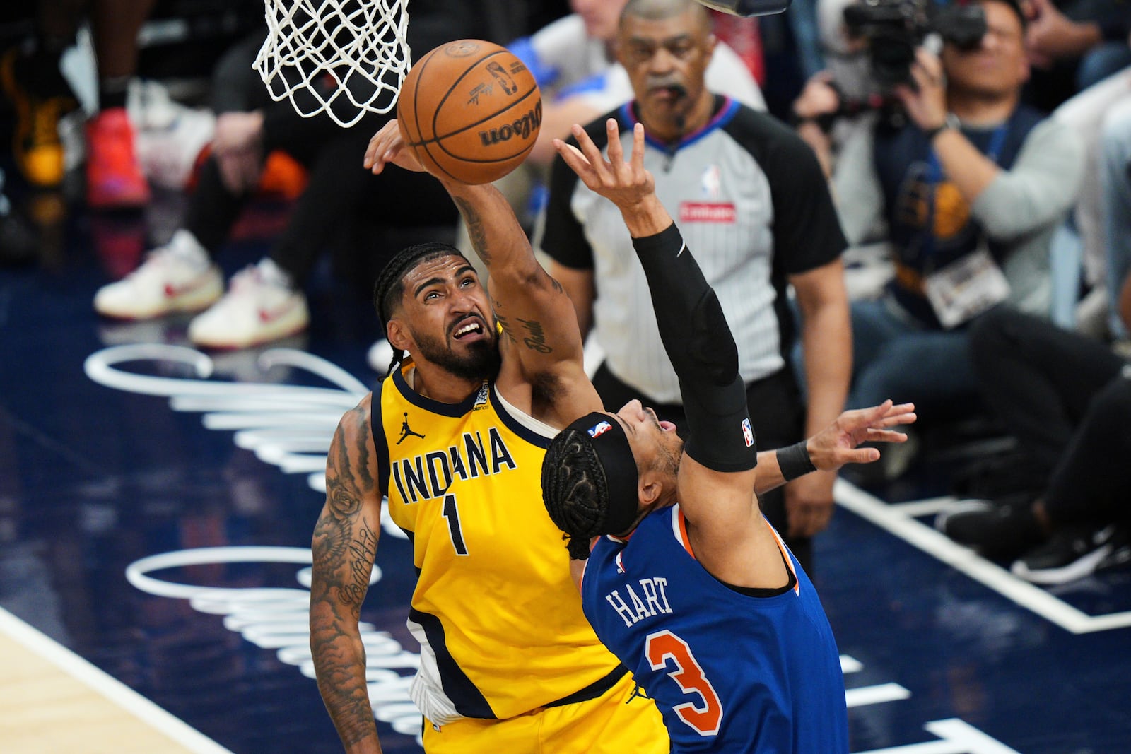 Indiana Pacers forward Obi Toppin (1) blocks a shot by New York Knicks guard Josh Hart (3) during the first half of Game 6 of the Eastern Conference finals of the NBA basketball playoffs in Indianapolis, Saturday, May 31, 2025. (AP Photo/AJ Mast)
