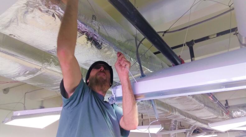 An electrician does renovations at Emerge Recovery and Trade initiative in Xenia, as the nonprofit prepares to open its recovery center for men next year. CONTRIBUTED