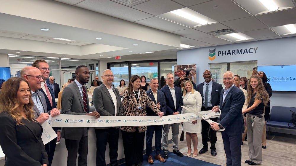 AbsoluteCare Chief Executive Officer Michael Radu cuts the ribbon officially opening the company's Cincinnati Street center. CONTRIBUTED