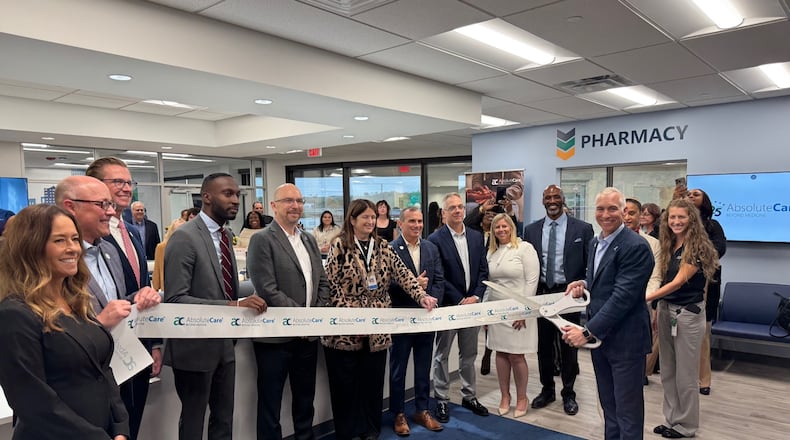 AbsoluteCare Chief Executive Officer Michael Radu cuts the ribbon officially opening the company's Cincinnati Street center. CONTRIBUTED