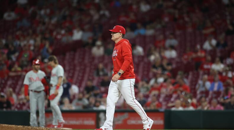 Reds manager David Bell walks to the mound in the ninth inning against the Phillies on Thursday, April 13, 2023, at Great American Ball Park in Cincinnati. David Jablonski/Staff