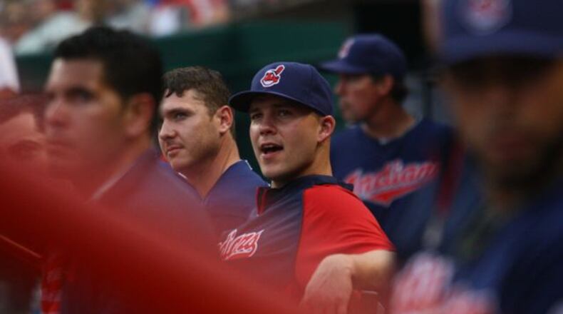 Beavercreek grad Justin Masterson watches the Indians play the Reds on Tuesday. David Jablonski/Staff