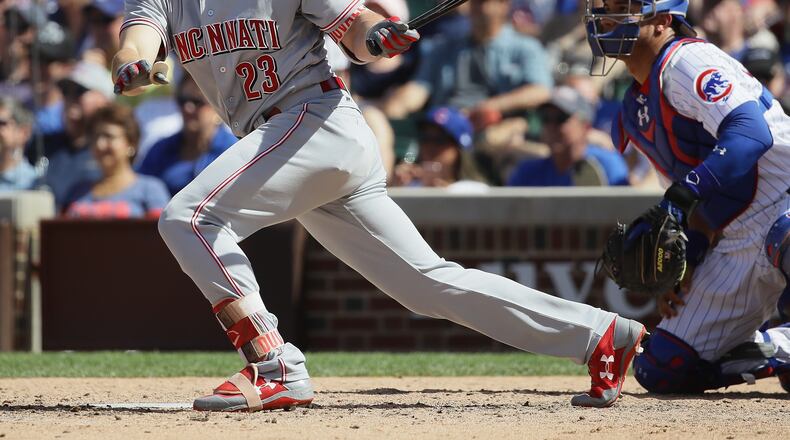 CHICAGO, IL - MAY 18: Adam Duvall #23 of the Cincinnati Reds hits a run scoing single in the 7th inning against the Chicago Cubs at Wrigley Field on May 18, 2017 in Chicago, Illinois. (Photo by Jonathan Daniel/Getty Images)