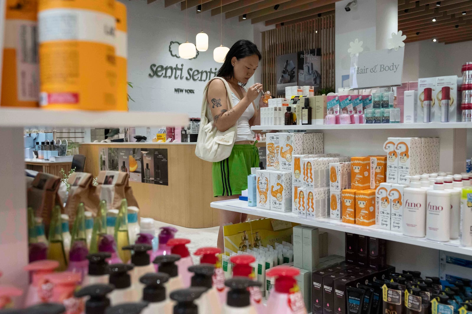 A customer checks out Asian beauty products at Senti Senti in New York on Friday, July 25, 2025. (AP Photo/Yuki Iwamura)