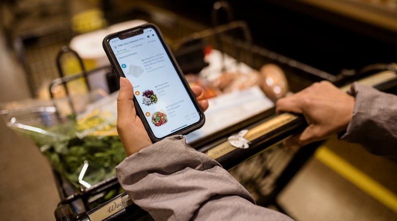 FILE — An Instacart shopper picks up groceries for a client delivery in Harrisburg, Pa., on Nov. 15, 2020. A new study organized by the Groundwork Collaborative, a progressive policy group, and Consumer Reports, a nonprofit consumer publication, found significant differences in prices charged to various online shoppers purchasing the same items, at the same time, from the same store, through the same delivery service. (Rosem Morton/The New York Times)