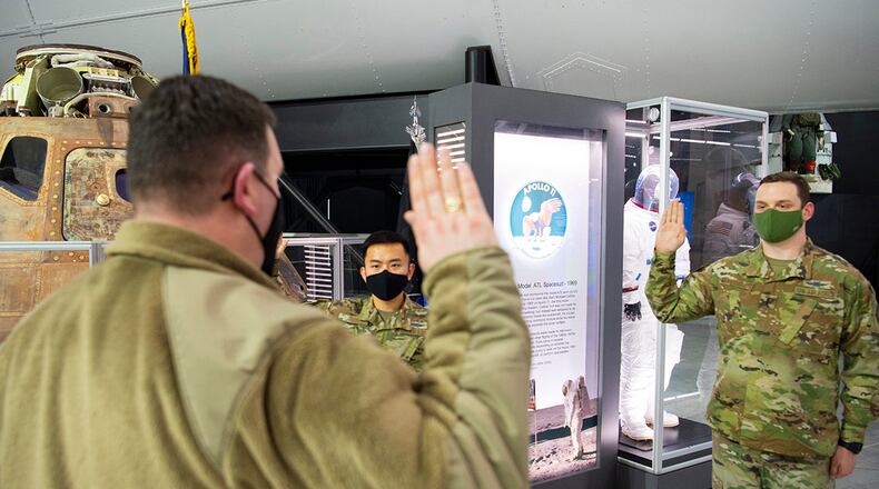 Air Force 1st Lt. Wyatt Chen and 1st Lt. Kyle McReynolds, both with the 88th Communications Squadron, take the oath of office on Feb. 11, joining the U.S. Space Force during a ceremony at the National Museum of the U.S. Air Force on Wright-Patterson Air Force Base. Air Force Lt. Col. Jeffrey Crépeau, 88 CS commander, administered the oath. U.S. AIR FORCE PHOTO/R.J. ORIEZ